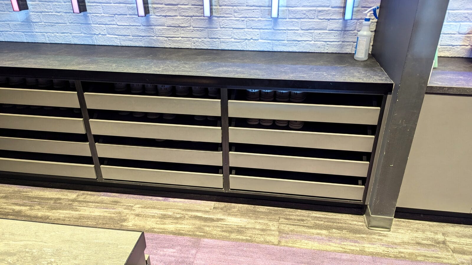 Bowling shoe storage shelves under counter