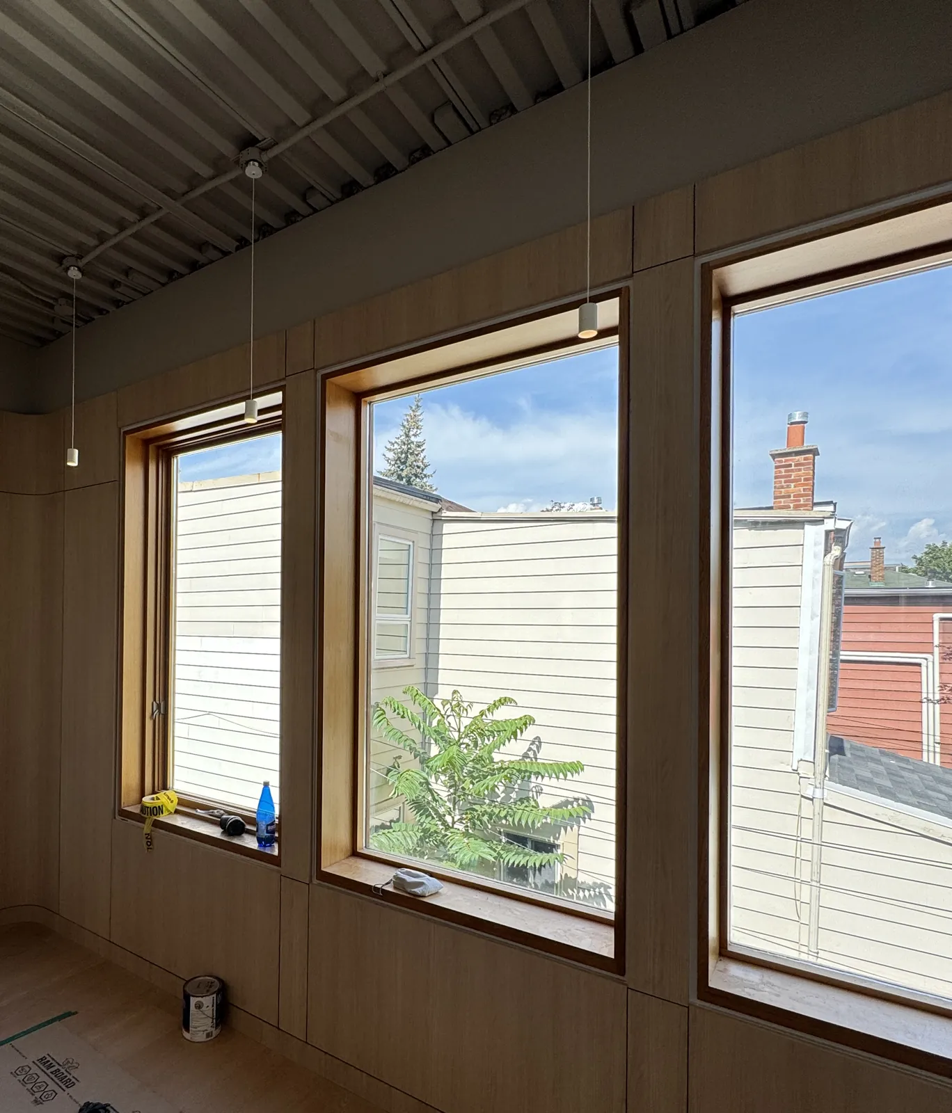 Full-height oak wall panelling fitted around windows in a retail fit-out