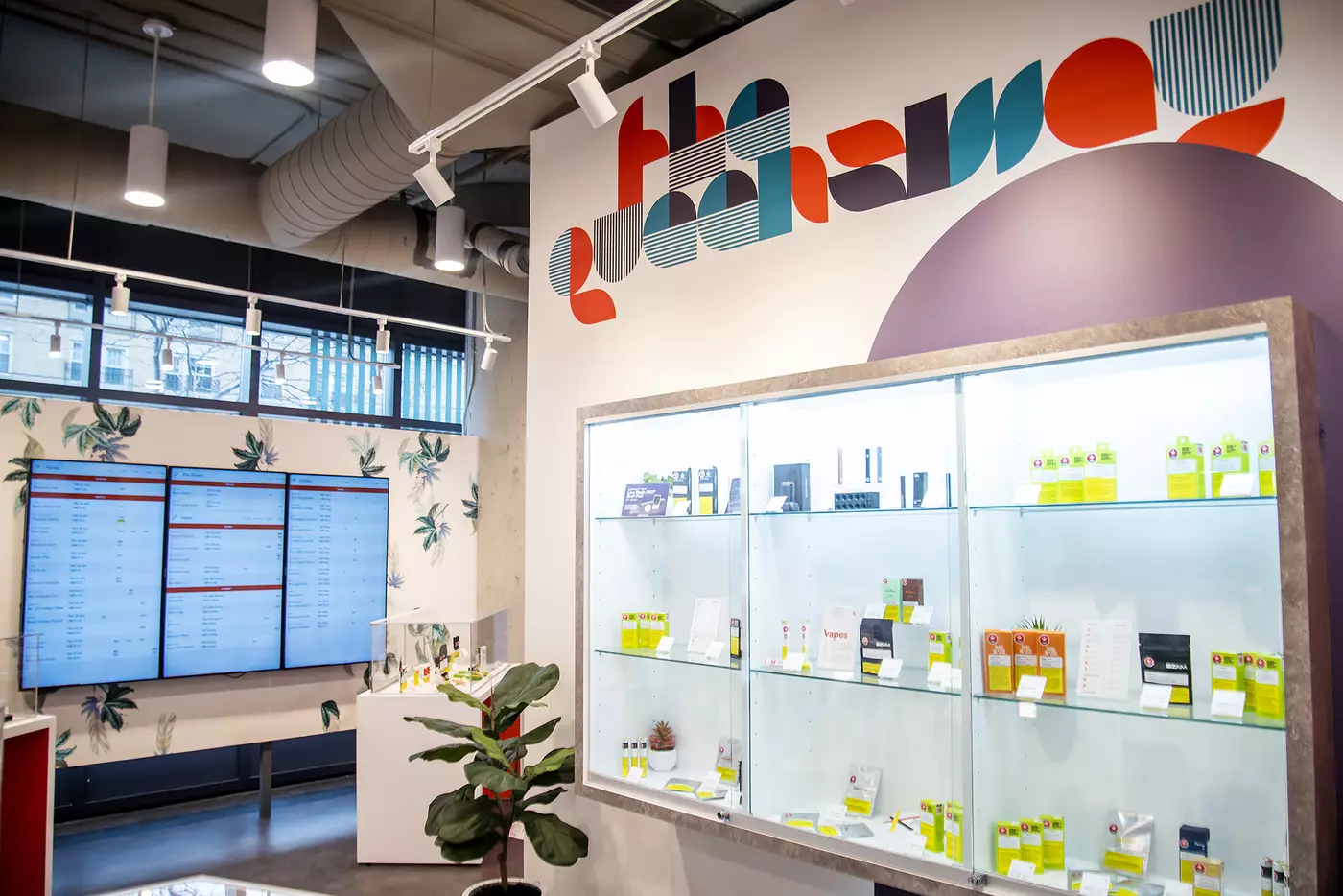 Modern cannabis dispensary interior with product displays and menus