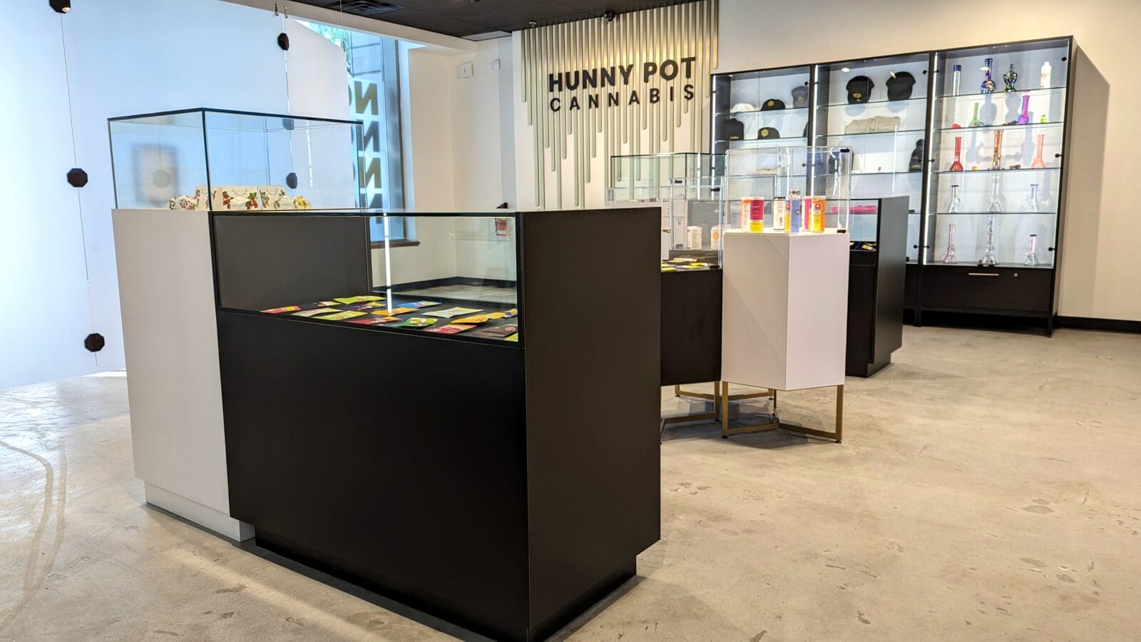 Modern cannabis dispensary interior with glass display cases