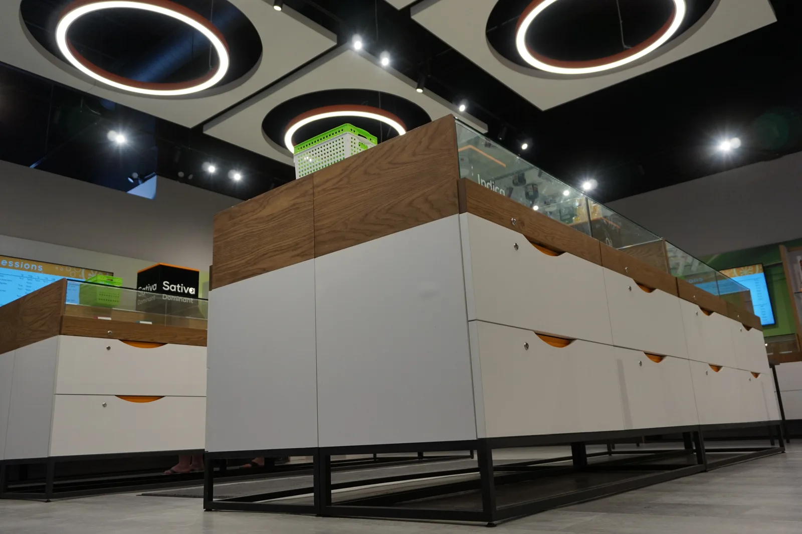 Sessions Cannabis Cambridge display counter with white lockable drawers and wood top on a black base