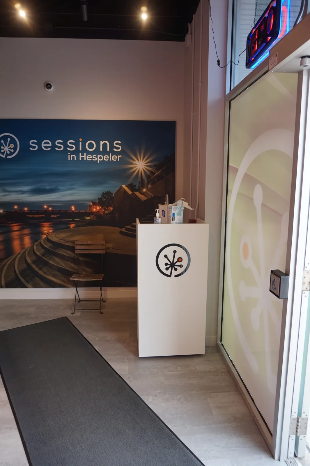 White entry podium with the Sessions logo at Sessions Cannabis in Hespeler, Cambridge